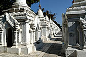 Myanmar - Mandalay, Kuthodaw Pagoda. 729 white pitaka pagodas contain the Tipitaka, the sacred texts of Theravada Buddhism. 